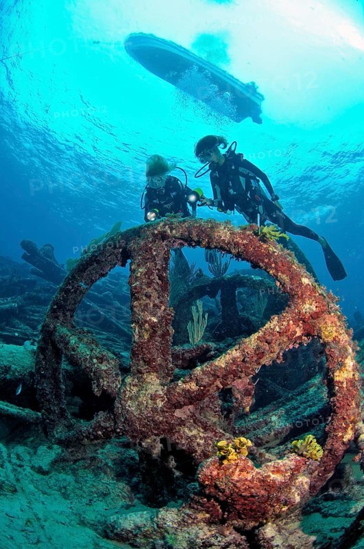 Diver on wreck with steel rudder