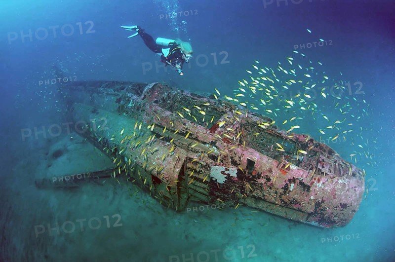 Divers at wreckage of McDonnell Douglas F-4 Phantom military aircraft