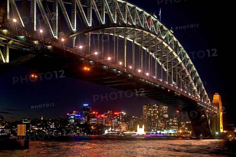 Sydney Harbour Bridge and view of the city skyline at night
