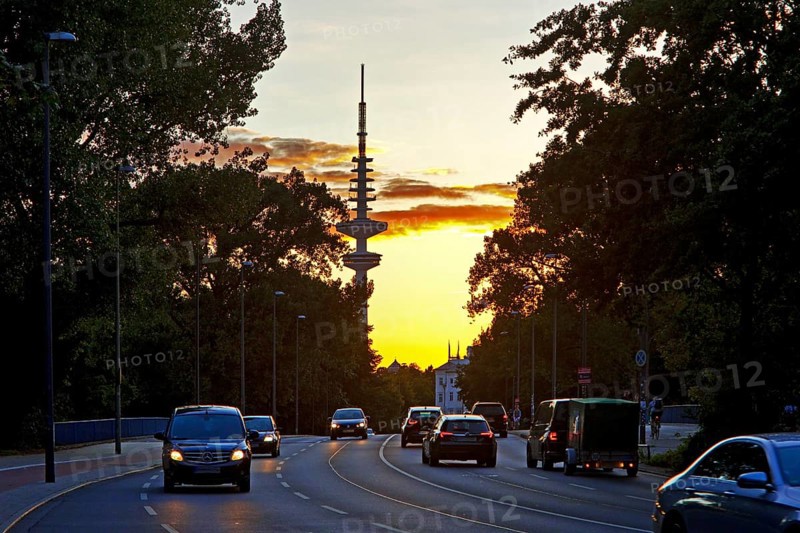 Cars on the Kennedy Bridge in front of the Heinrich Hertz Tower at sunset
