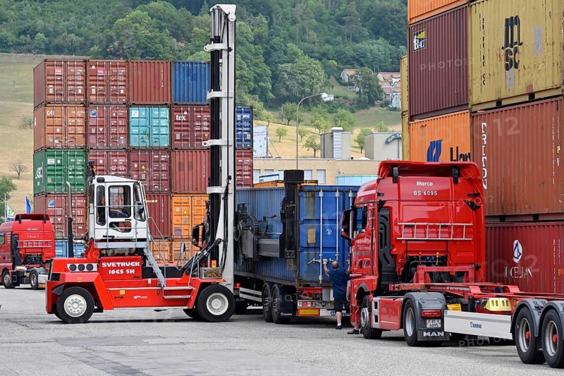 Container stacker loading freight containers
