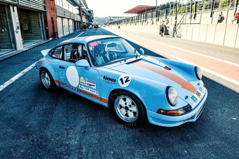 60s style shot of historic racing car sports car classic car Porsche 911 RS in pit lane Pit Lane of race track