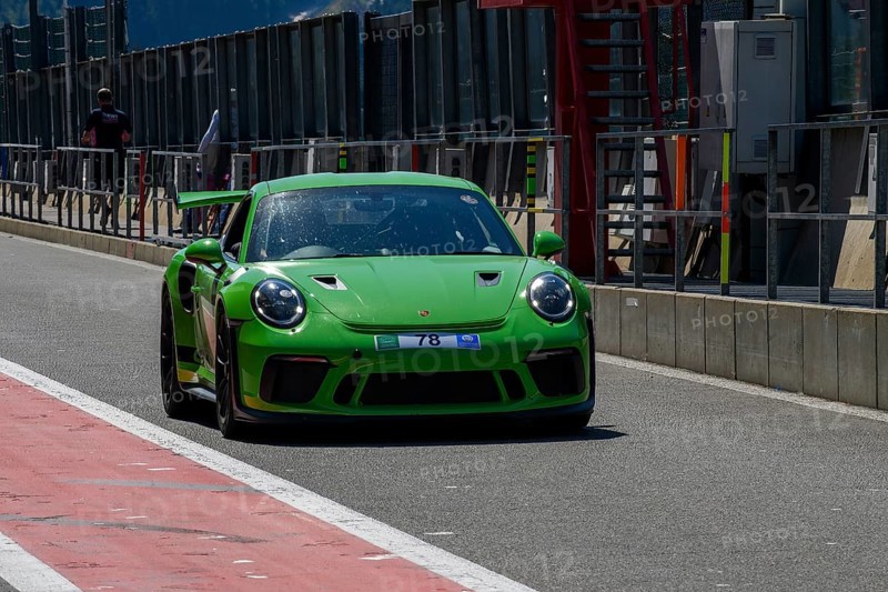 Green racing car Sports car Porsche 911 GT3 RS in pit lane Pit Lane of race track