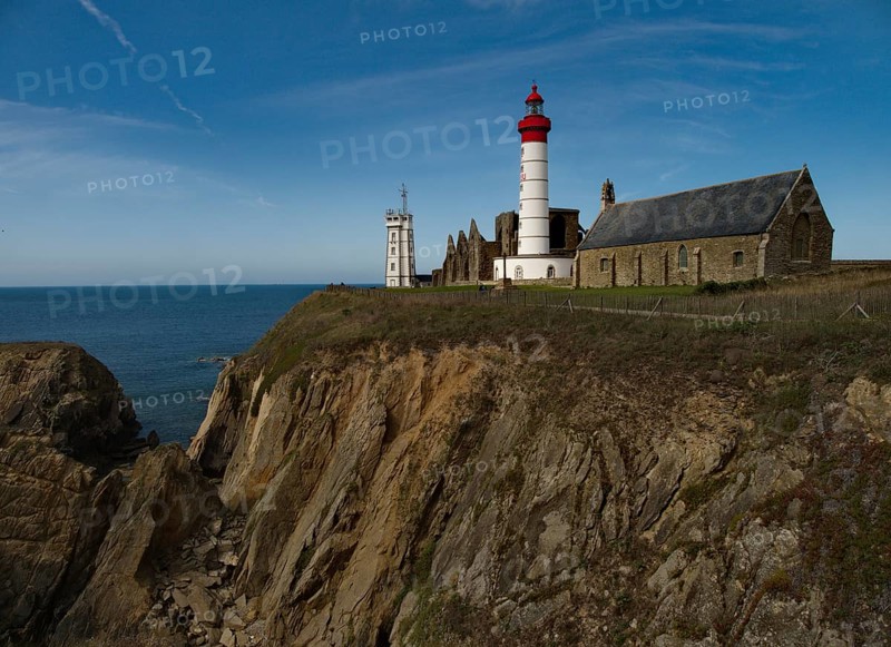 The lighthouse Phare de Saint-Mathieu with the chapel Notre Dame de Grace of Our Lady of Grace in the department of Finistere at the western tip of Brittany
