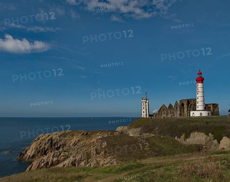 The lighthouse Phare de Saint-Mathieu with the chapel Notre Dame de Grace of Our Lady of Grace in the department of Finistere at the western tip of Brittany