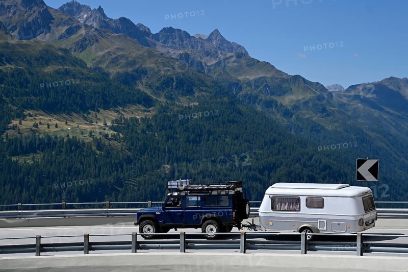 Off-road vehicle with caravan Gotthard Pass