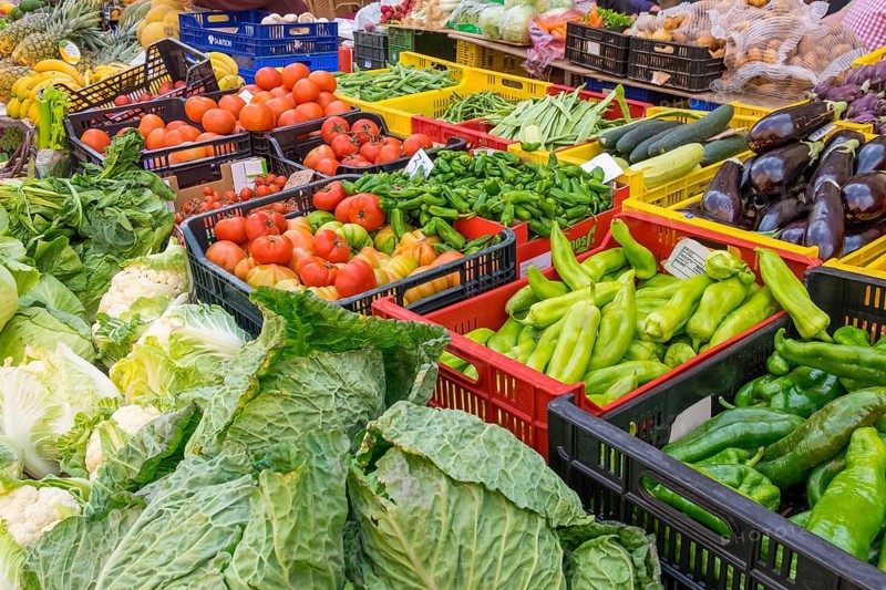 Market stall with various vegetables such as savoy cabbage