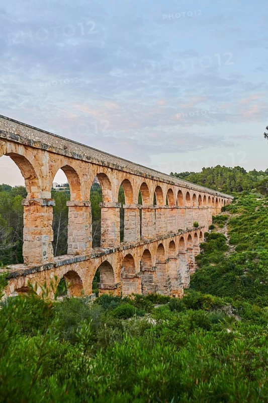 Old roman aqueduct at sunrise