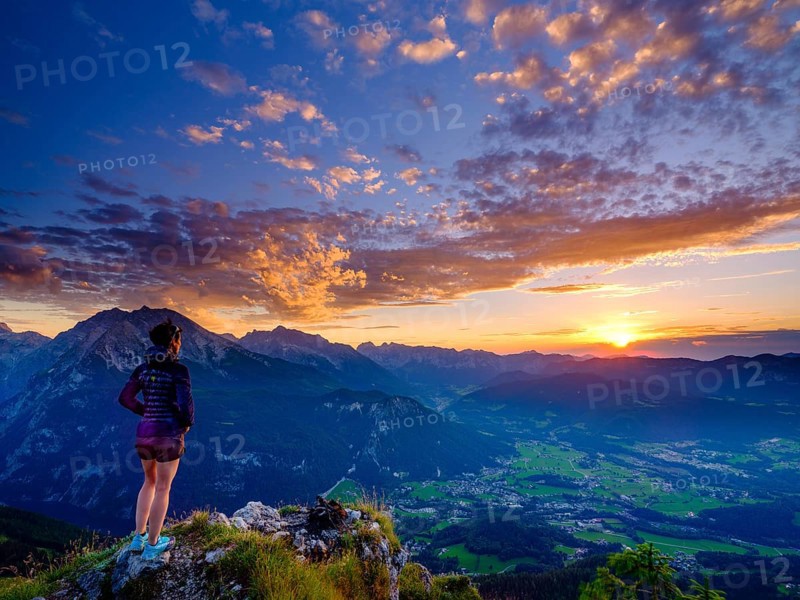 Mountaineer looking at sunset