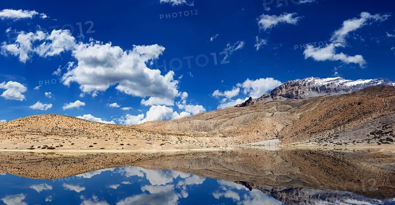 Mountain lake in Himalayas with reflection panorama. Dhankar