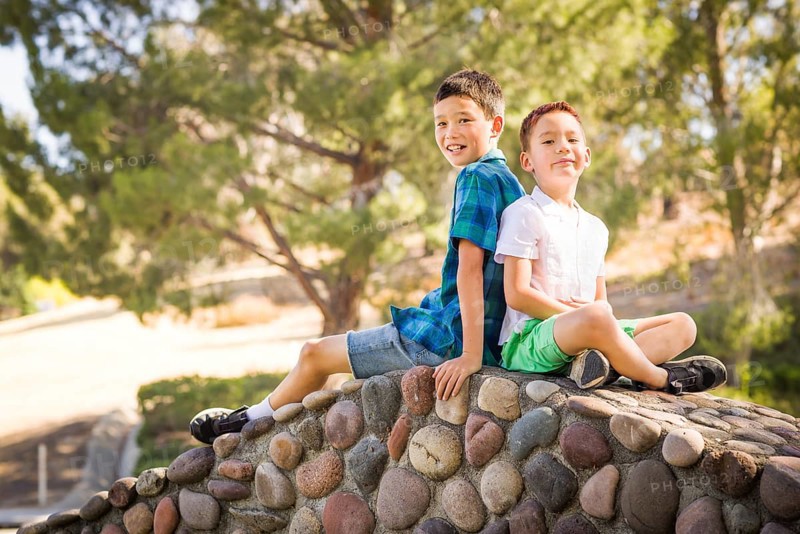 Outdoor portrait of biracial chinese and caucasian brothers
