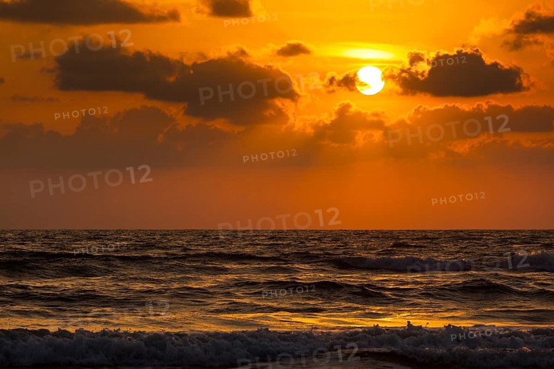 Ocean sunset concept background. Baga beach. Goa