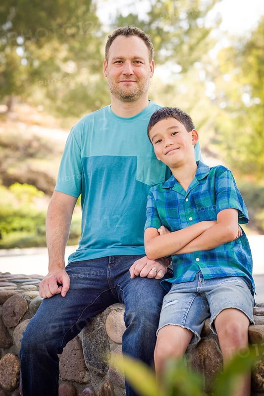Outdoor portrait of biracial chinese and caucasian father and son
