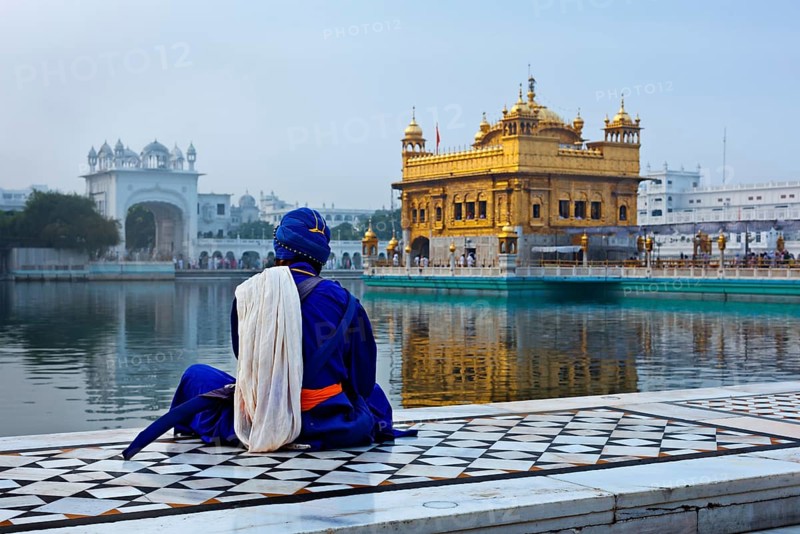 Unidentifiable Seekh Nihang warrior meditating at Sikh temple Harmandir Sahib. Amritsar