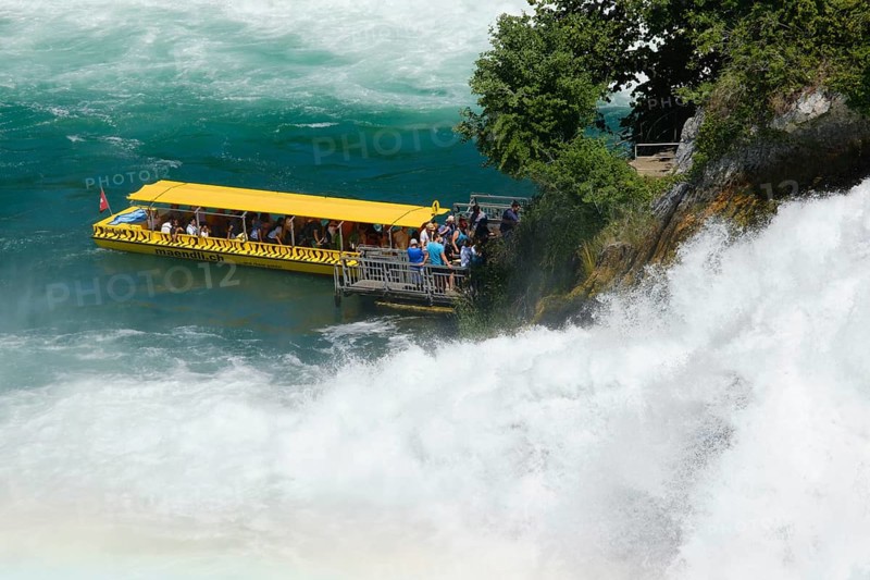 Tourist boat at the jetty of the viewing rock in the Rhine Falls