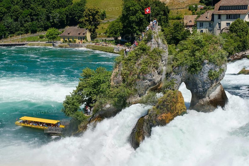 Tourist boat at the jetty of the viewing rock in the Rhine Falls