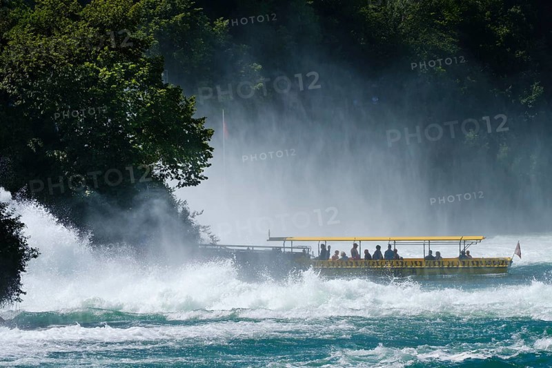 Tourist boat at the jetty of the Aussichtfelsen at the Rhine Falls