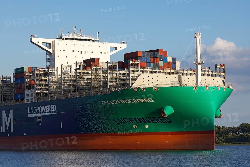 Container ship CMA CGM TROCADERO powered by liquefied natural gas LNG leaves the port of Hamburg on the river Elbe