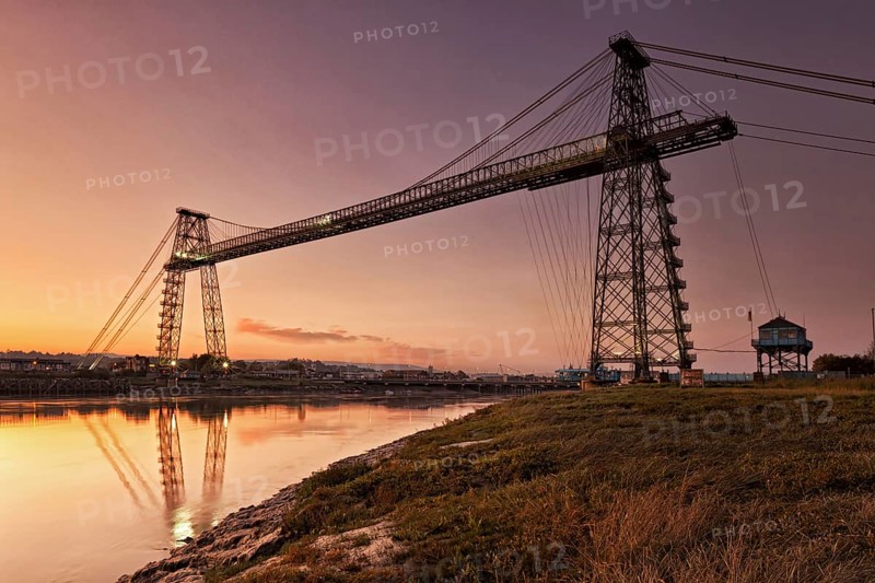 View of the transporter bridge over the river at dusk