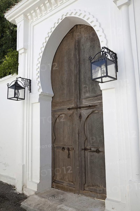 Wooden door and lanterns in a coastal city street