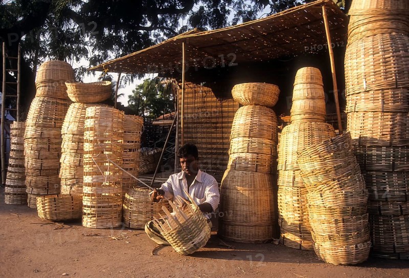 A man weaving bamboo strips baskets at Lawley Road in Coimbatore