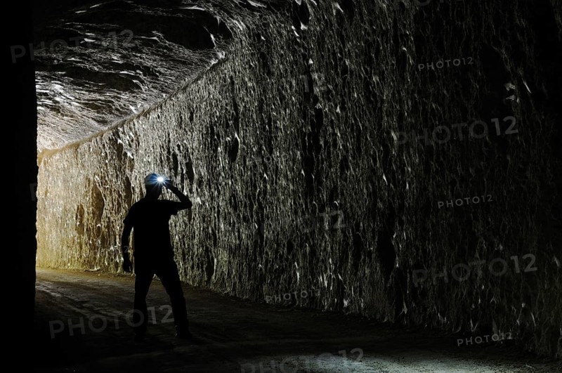 Speleologist enters abandoned cave