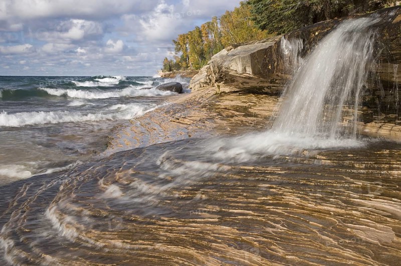 Waterfall flowing into a freshwater lake