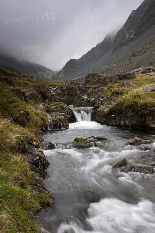 High mountain stream with cascade