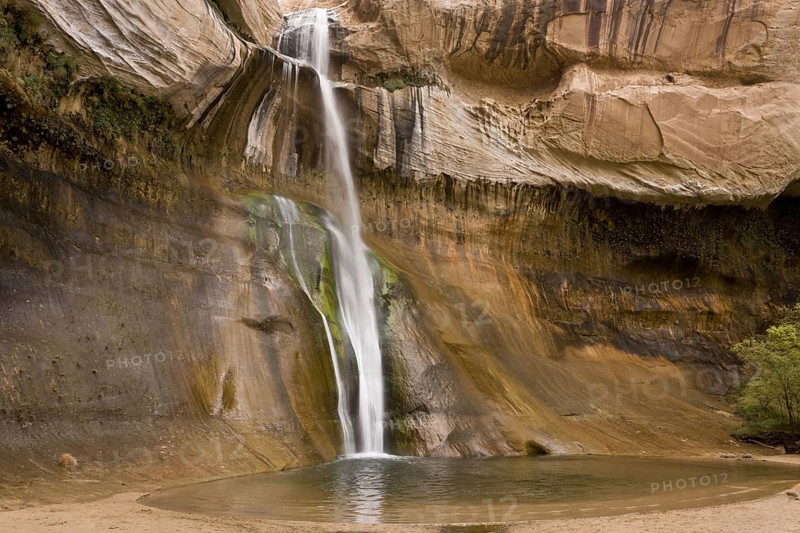 Waterfall cascading over navajo sandstone