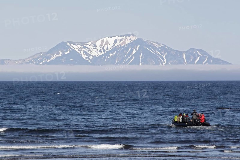 Zodiac inflatable boat with tourists at sea