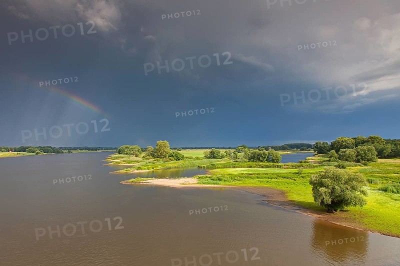Rainbow over the Elbe River Landscape UNESCO Biosphere Reserve in summer