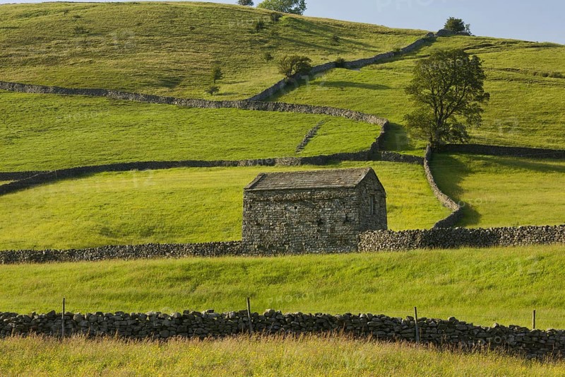 View of stone barn and drystone walls