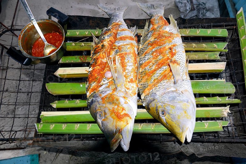 Creole-style snapper marinated on a charcoal grill