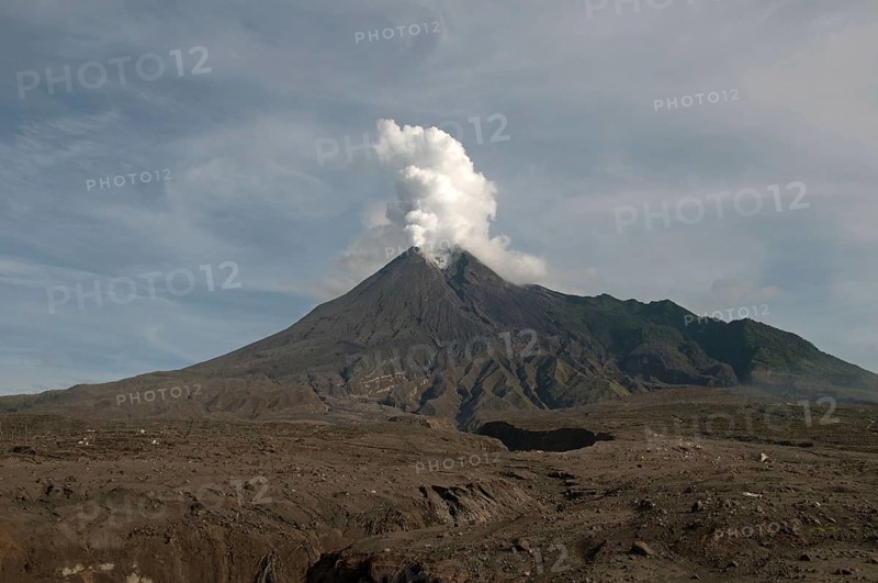 Recently erupted volcano with ash clouds