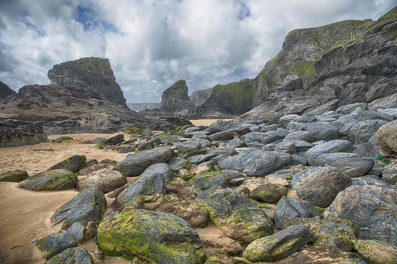 View of beach with slate cliffs
