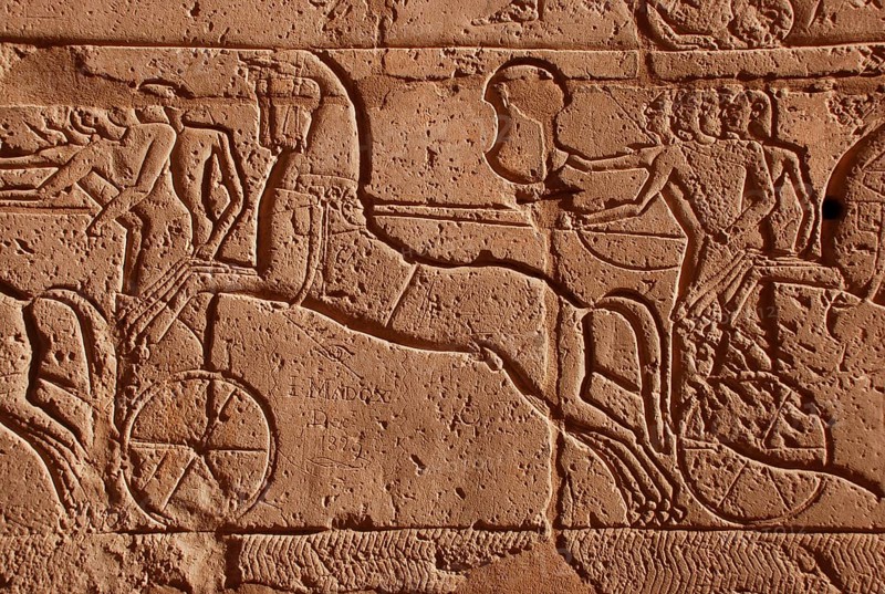 Wall relief of a chariot with graffiti from the 19th century