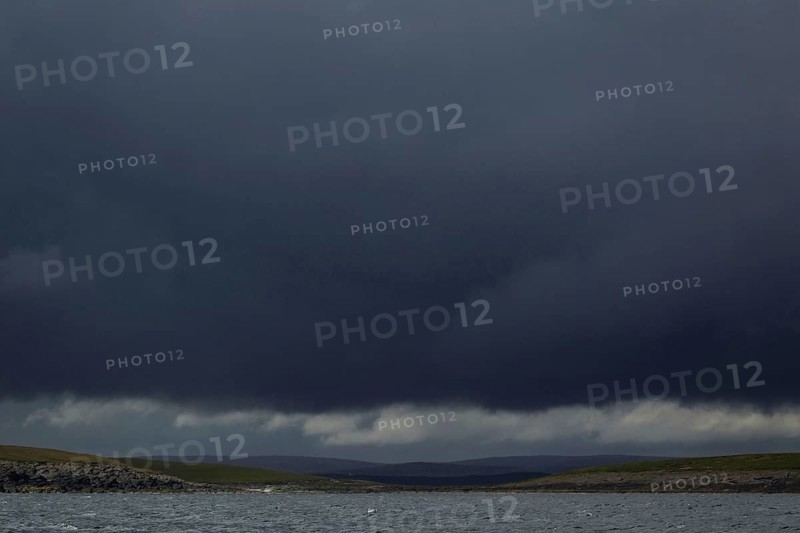Storm clouds and coastline