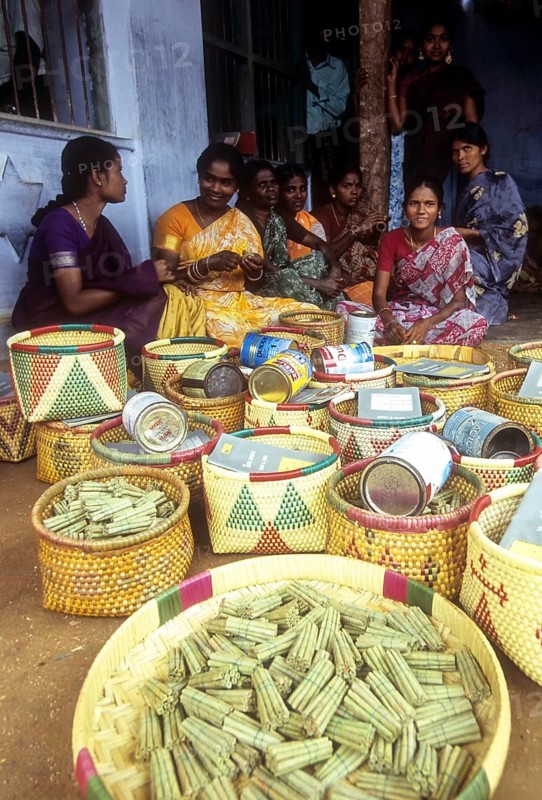 Beedi workers waiting for deliver their rolled beedis to the company