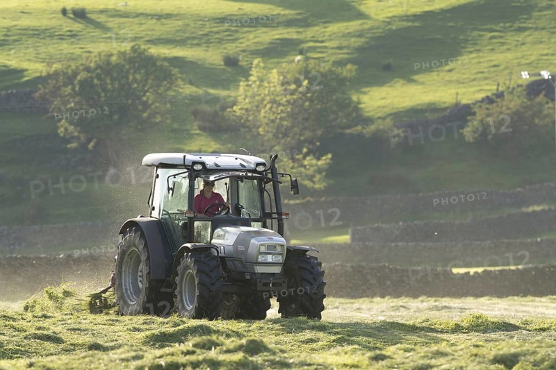 Hurlimann tractor with tedder