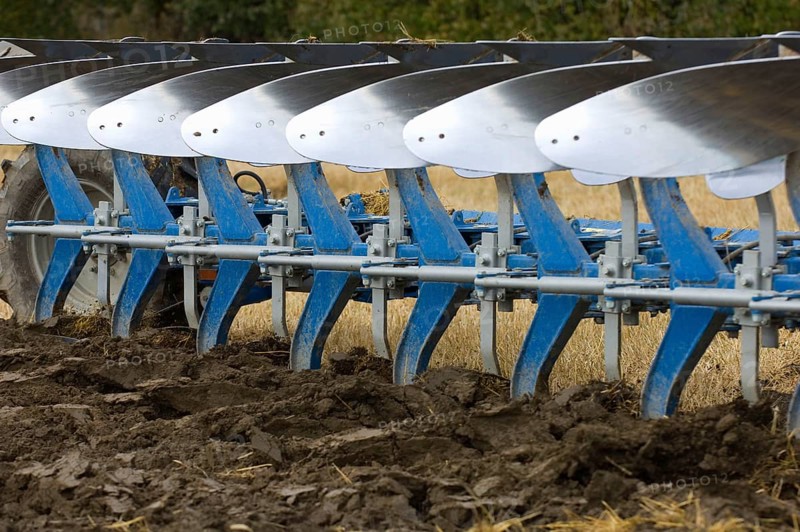 Close-up of an eight-furrow reversible plough