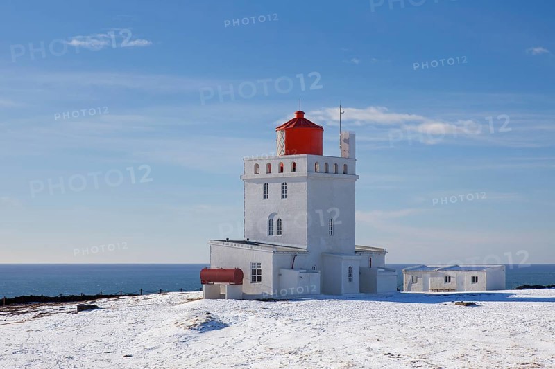 Dyrholaey lighthouse near Vik i Myrdal on the central south coast of Iceland in the snow in winter