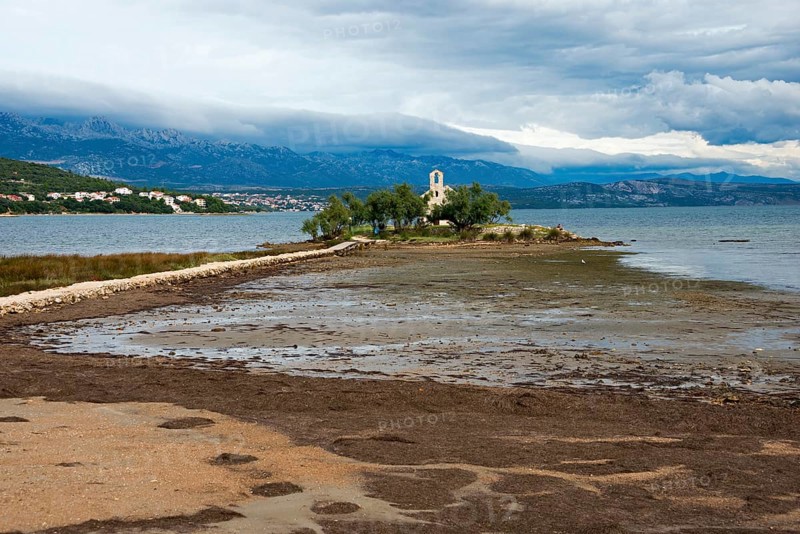 Church of Sveti Duh on island in Novigradsko Lake