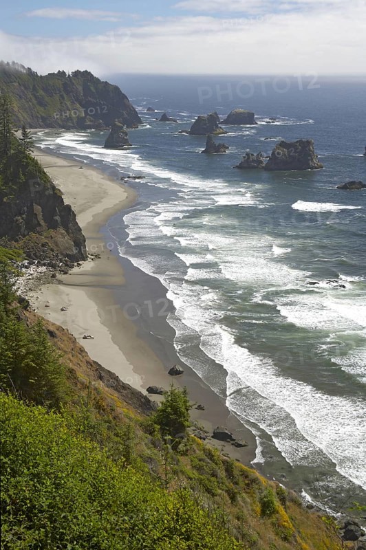 View of the coastline with offshore chimneys