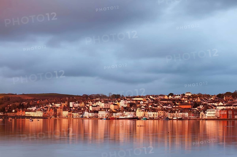 View across the estuary at high tide towards the town