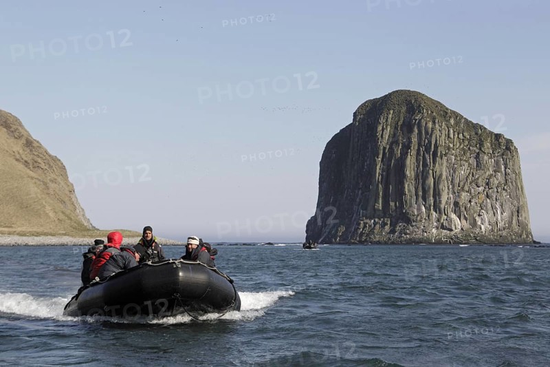 Zodiac inflatable boat with tourists at sea