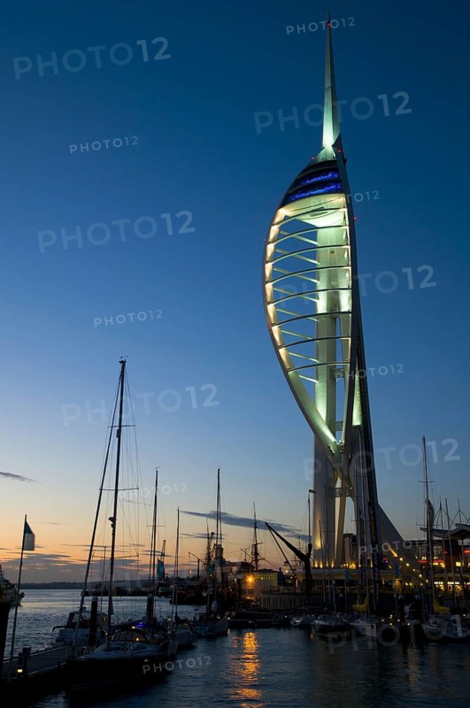 View of harbour and waterfront with Spinnaker Tower illuminated after sunset