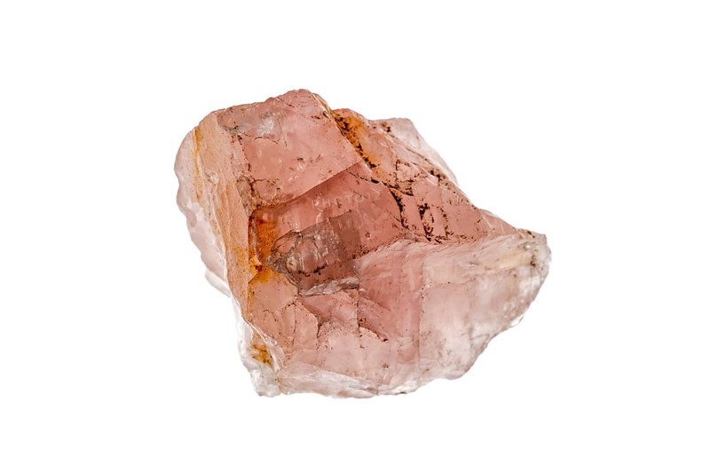 Rose quartz sample on white background