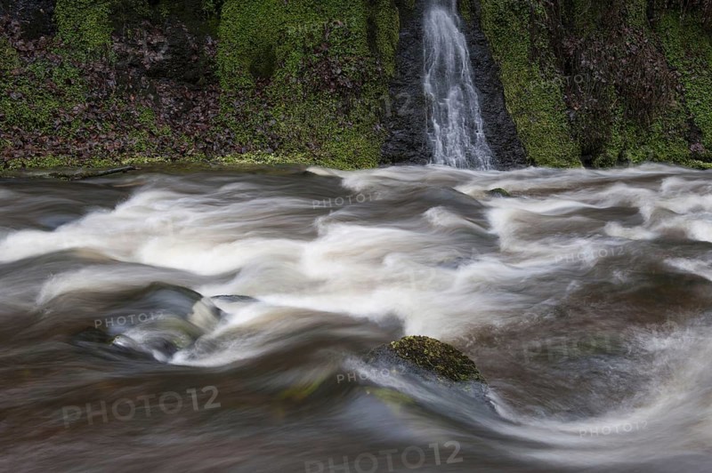 Fast flowing river in spate following storm