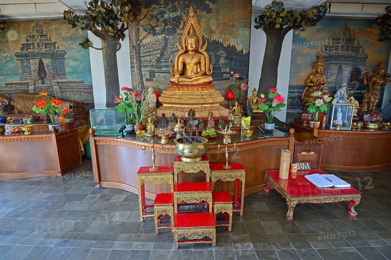 Buddha statue on an altar in a prayer room of the Buddhist monastery Brahma Vihara