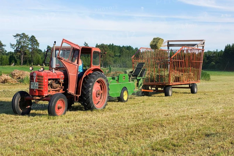Tractor baling hay